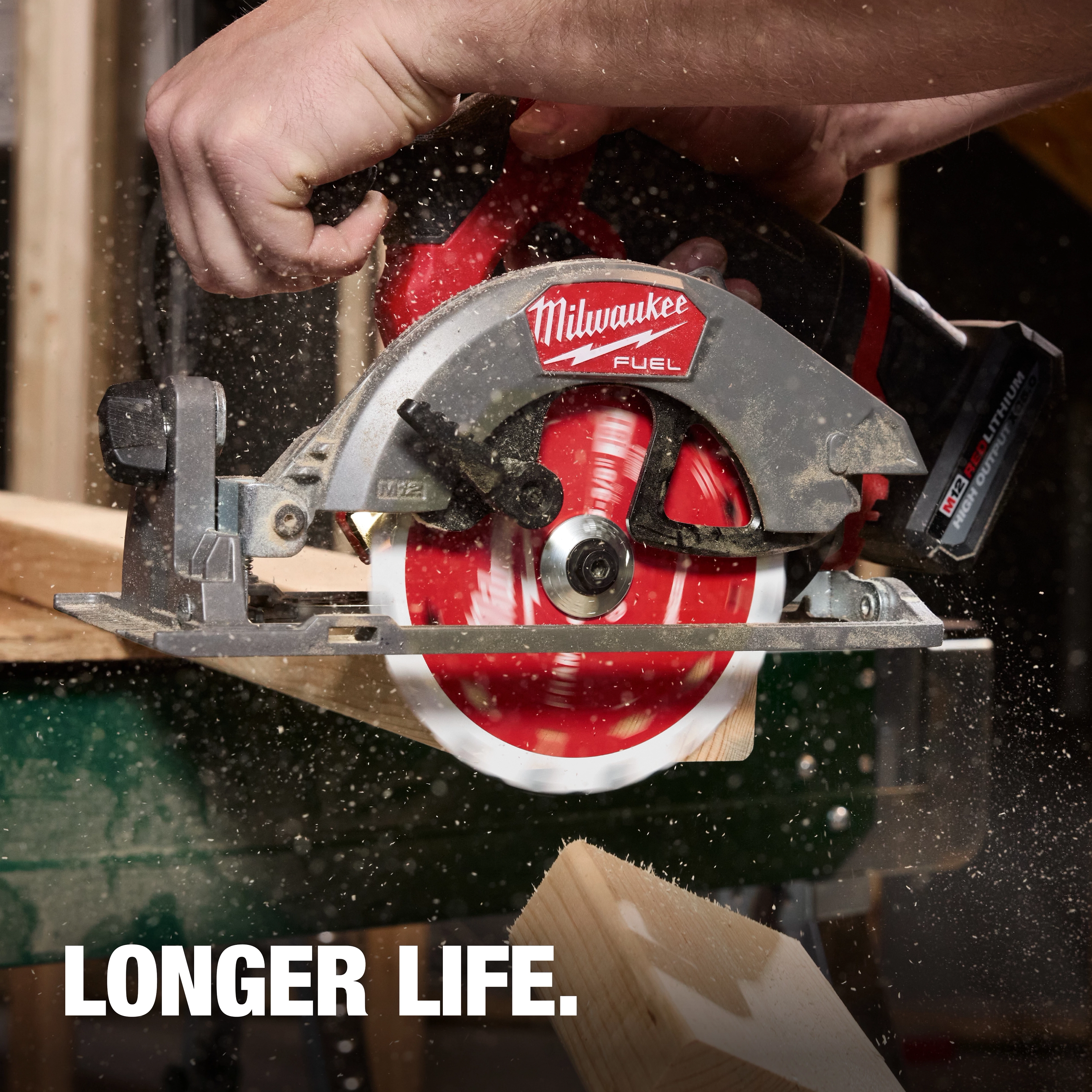 5-3/8" 16T Framing Circular Saw Blade cutting through wood on a circular saw with sawdust flying.