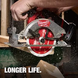 5-3/8" 16T Framing Circular Saw Blade cutting through wood on a circular saw with sawdust flying.