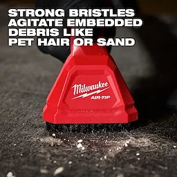 AIR-TIP Automotive Detail Brush with strong bristles shown cleaning embedded debris like pet hair or sand from a surface.