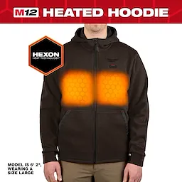 M12™ Heated Hoodie features Hexon Heat Technology, shown warming the chest area, worn by a 6'2" model in size large. The hoodie is black with a front zipper and two pockets.
