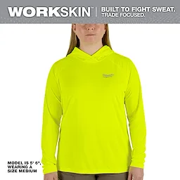 Model wearing a bright yellow Women's WORKSKIN Hooded Sun Shirt, size medium. The shirt has long sleeves and a hood.