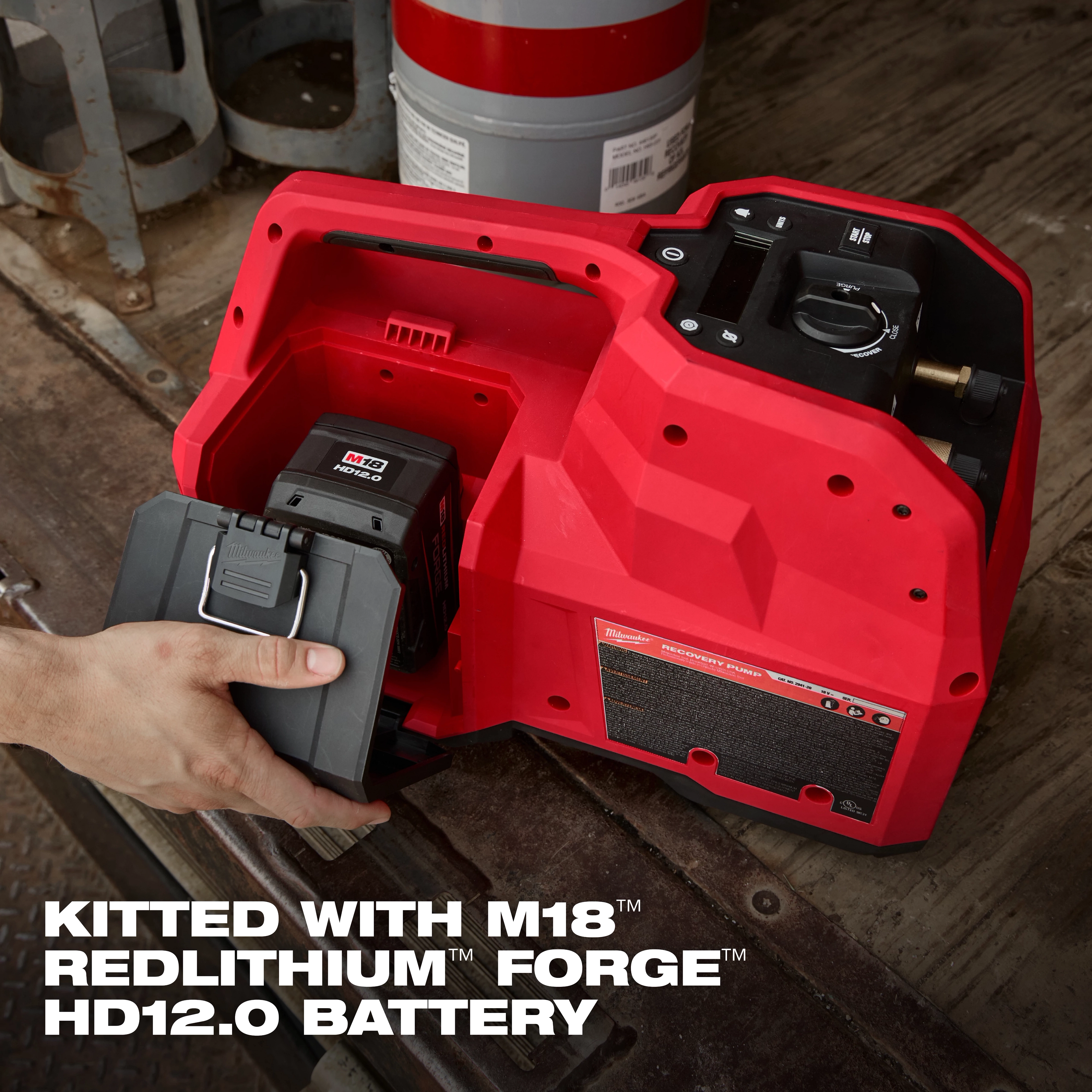 The M18 Brushless Refrigerant Recovery Machine is red, with a user inserting the M18 Redlithium Forge HD12.0 battery into the device.