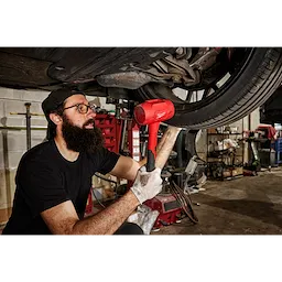 Worker using the 48oz Dead Blow Hammer for automotive use
