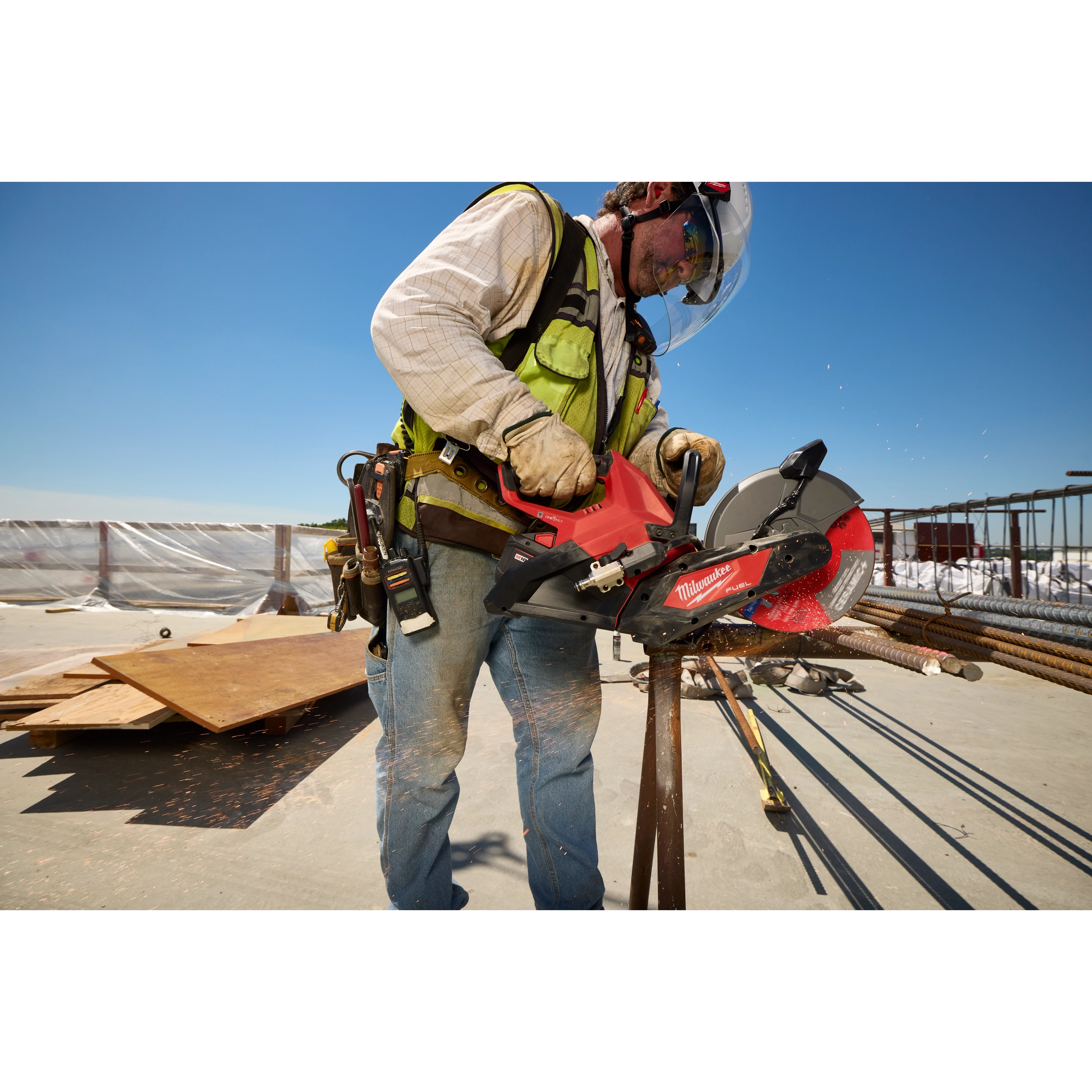 Worker cutting metal rebar on a construction site using an M18 FUEL 9” Cut-Off Saw w/ ONE-KEY.