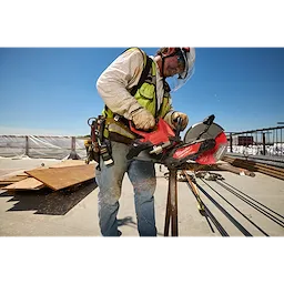 Worker cutting metal rebar on a construction site using an M18 FUEL 9” Cut-Off Saw w/ ONE-KEY.