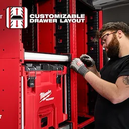 Milwaukee PACKOUT™ Rack with customizable drawer layout. Image shows the red storage system being organized with various compartments and drawers.