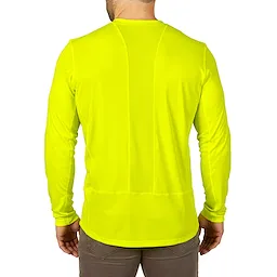 Back view of a man wearing a bright yellow WORKSKIN Lightweight Performance Shirt with long sleeves and beige pants.