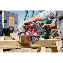 10-1/4" 40T Thick Kerf Finish Circular Saw Blade mounted on a circular saw cutting a wooden beam on a jobsite.