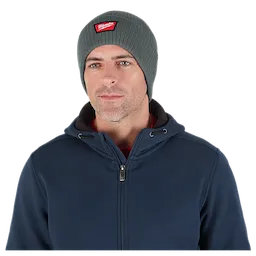Image of a man wearing the Milwaukee Rib-Knit Cuffed Beanie in green