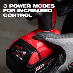 The M18™ Brushless Precision Blower features three power modes for increased control. The image shows a gloved hand adjusting the power mode slider from 1 to 2. The blower has a red and black design and operates with an M18 REDLITHIUM battery, highlighted by text in the image.