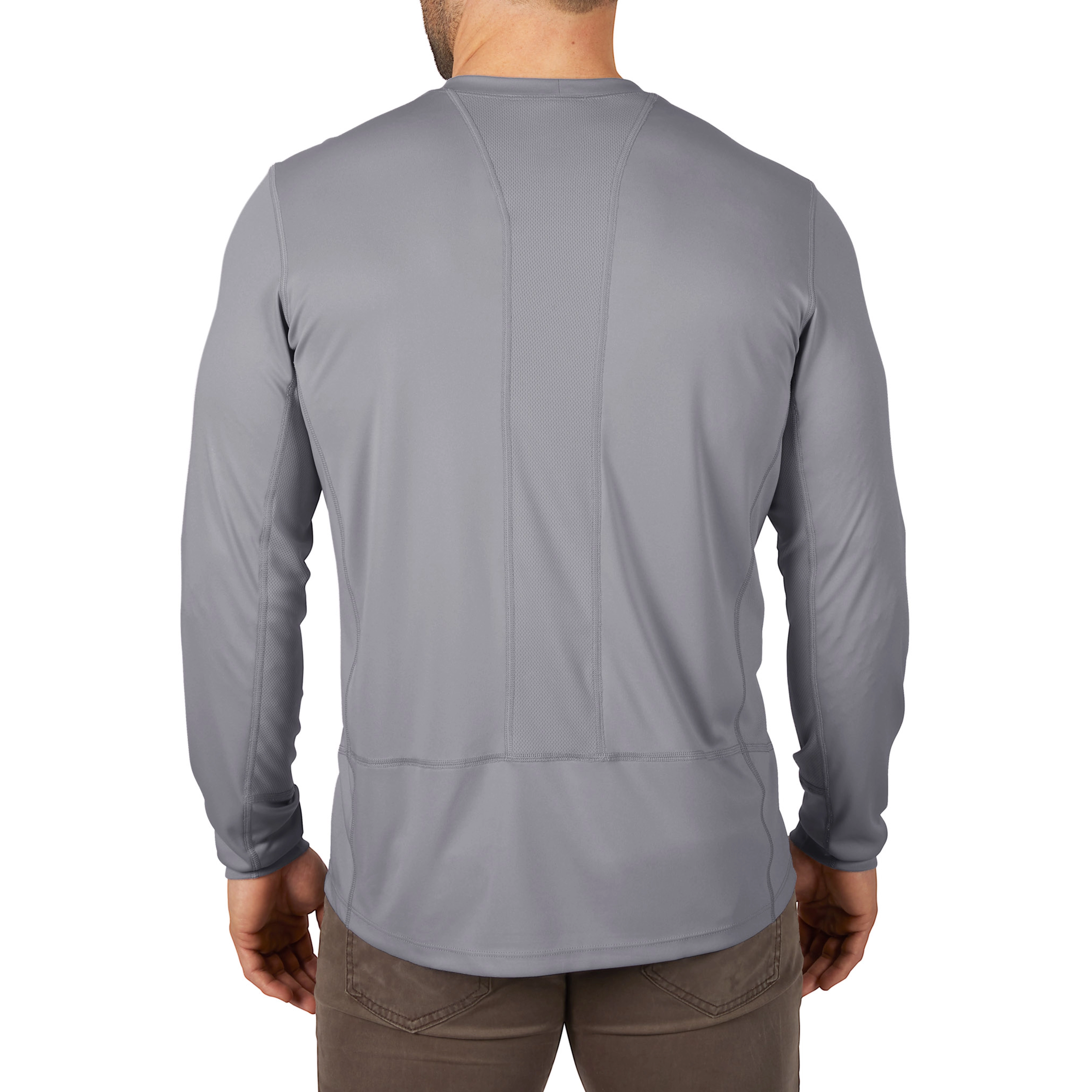 Man wearing a gray, long-sleeve WORKSKIN Lightweight Performance Shirt, viewed from the back, paired with brown pants.
