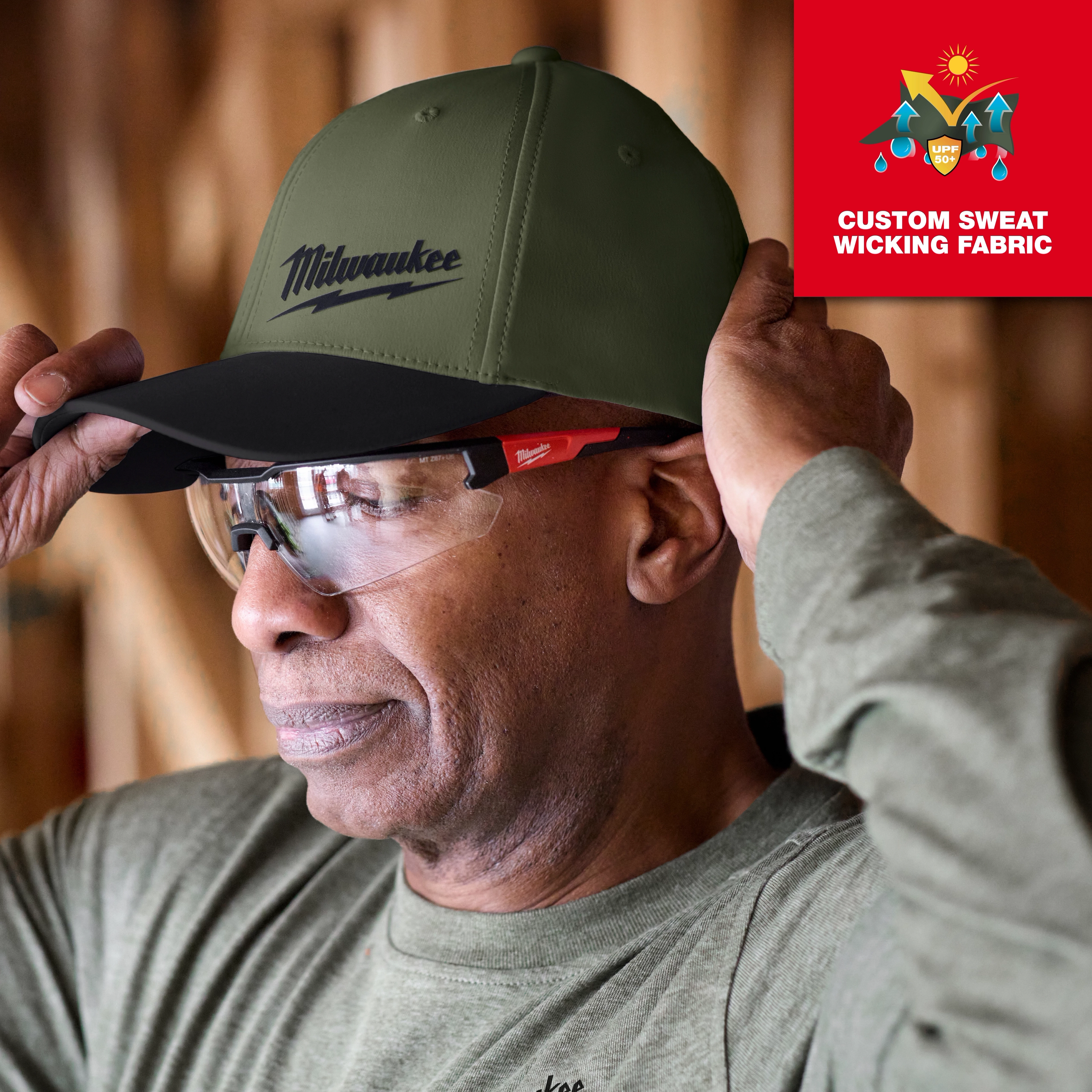 WORKSKIN Performance Fitted Hat in olive green being worn. Features UPF 50+ sun protection. 