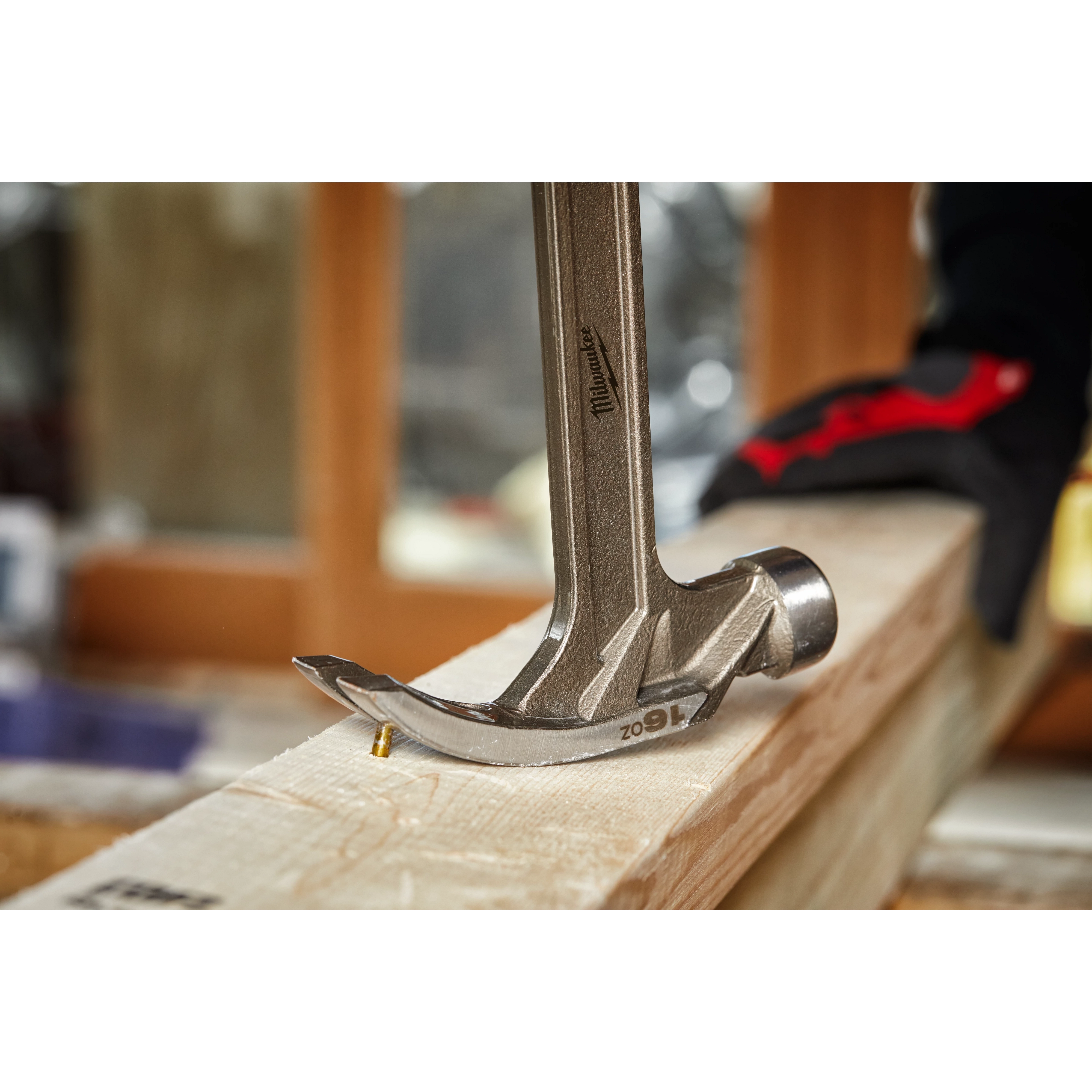 The Hammer Expansion extracting nails from a wood board