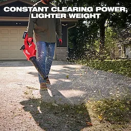A person uses the Milwaukee M18 Brushless Blower to clear debris on a driveway in front of a garage. The text reads "Constant Clearing Power, Lighter Weight" above it.