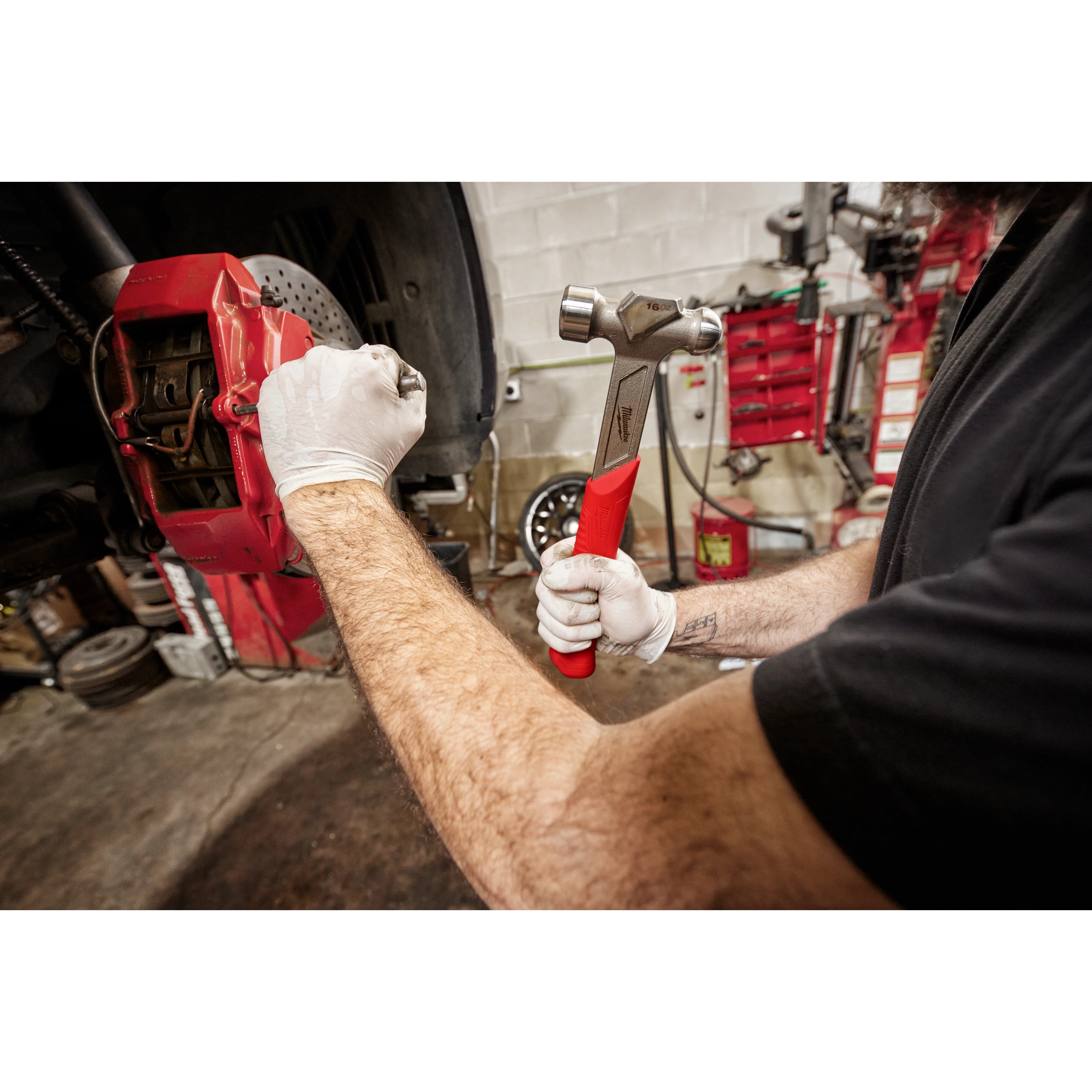 Worker using the 16oz Steel Ball Peen Hammer