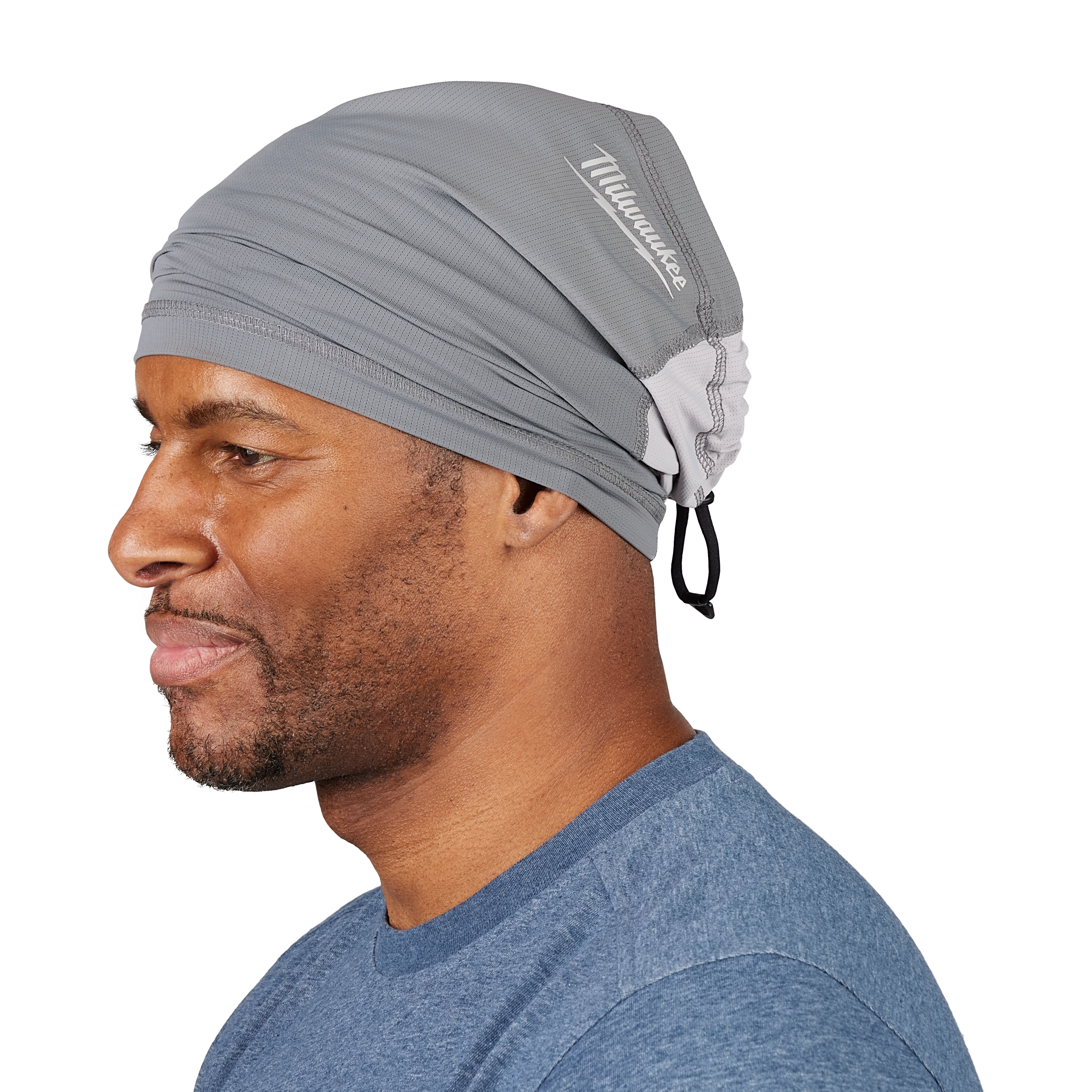 Side view of a person wearing a gray WORKSKIN Performance Neck Gaiter, which covers their head and neck.
