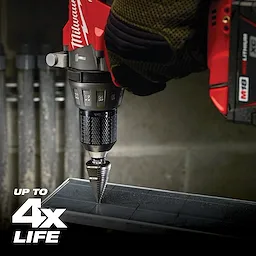 A drill equipped with a Jam Free Step Bits is shown in use, drilling through a piece of metal. Text on the image states "Up to 4x Life." The drill features a red and black color scheme with visible numerical measurements.