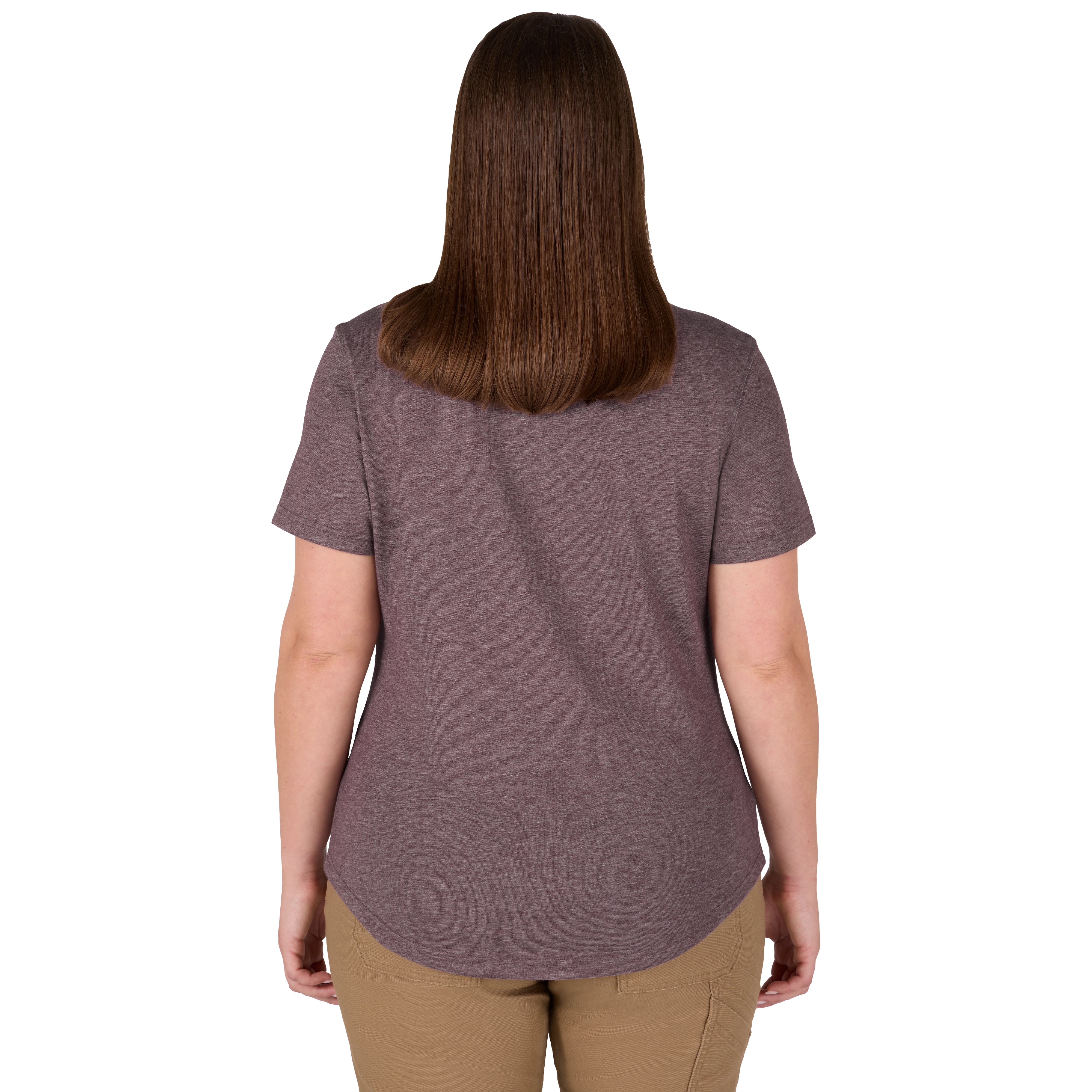 A woman is standing facing away, wearing the Women's FREEFLEX™ Hybrid Tee - Short Sleeve in purple. The shirt has a rounded hem and is paired with beige pants. Her brown hair is straight and reaches her shoulders.