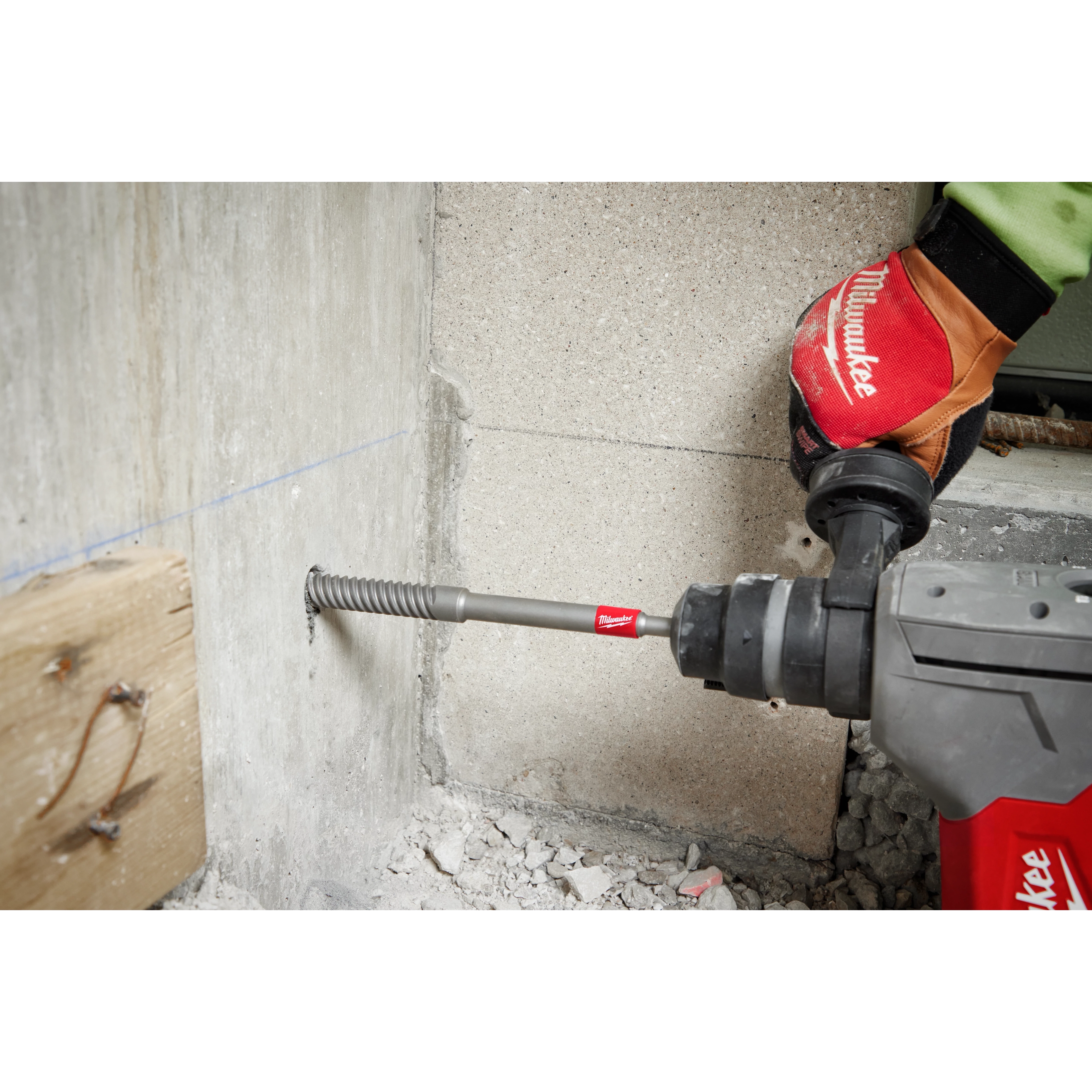 Worker using the SDS Plus 3/4" by 12" Rebar Cutter to drill through rebar